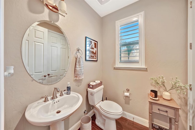 11617 N Bella Verde Ave, Fresno, CA 93730 - bathroom with a sink and wood finished floors