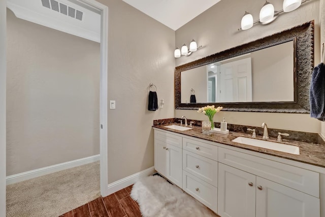 11617 N Bella Verde Ave, Fresno, CA 93730 - bathroom with double vanity and wood finished floors