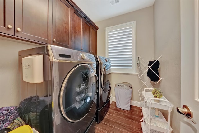 11617 N Bella Verde Ave, Fresno, CA 93730 - washroom featuring washer and dryer, cabinet space, and dark wood finished floors