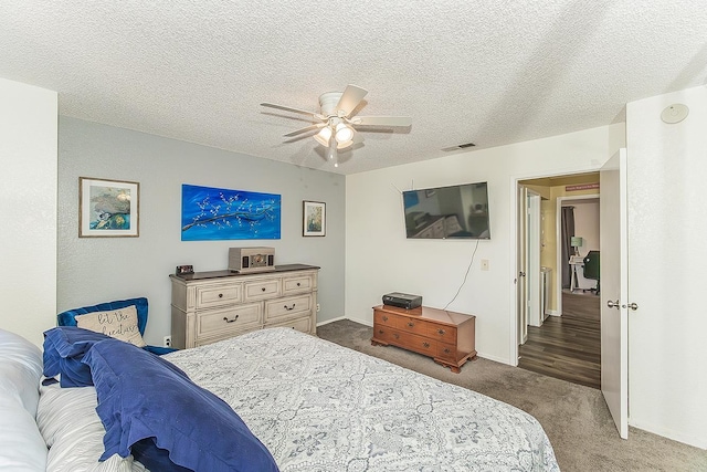 4885 N Backer Ave Unit 113, Fresno, CA 93726 - carpeted bedroom featuring ceiling fan and a textured ceiling