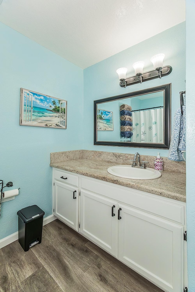 4885 N Backer Ave Unit 113, Fresno, CA 93726 - bathroom with wood finished floors and vanity