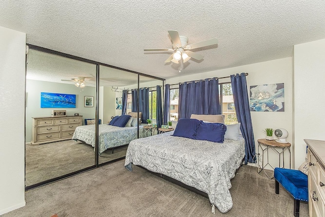 4885 N Backer Ave Unit 113, Fresno, CA 93726 - bedroom with carpet flooring, a closet, a textured ceiling, and ceiling fan