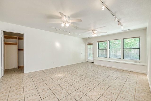 545 W Fedora Ave, Fresno, CA 93705 - unfurnished room featuring rail lighting, light tile patterned flooring, and ceiling fan