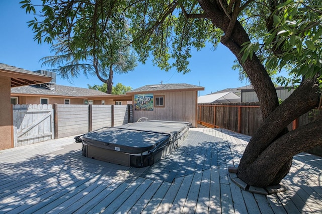 545 W Fedora Ave, Fresno, CA 93705 - wooden deck featuring a hot tub and a fenced backyard