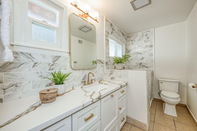545 W Fedora Ave, Fresno, CA 93705 - bathroom with vanity, tile patterned floors, and tile walls