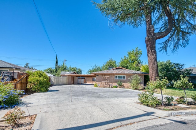 545 W Fedora Ave, Fresno, CA 93705 - ranch-style house featuring concrete driveway, a carport, and stucco siding