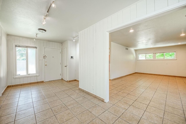 545 W Fedora Ave, Fresno, CA 93705 - spare room with light tile patterned floors and a textured ceiling