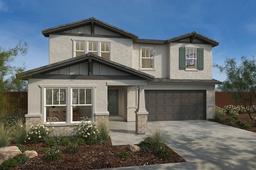 5145 E Audrie, Fresno, CA 93725 - view of front of property featuring a garage, concrete driveway, stucco siding, and stone siding