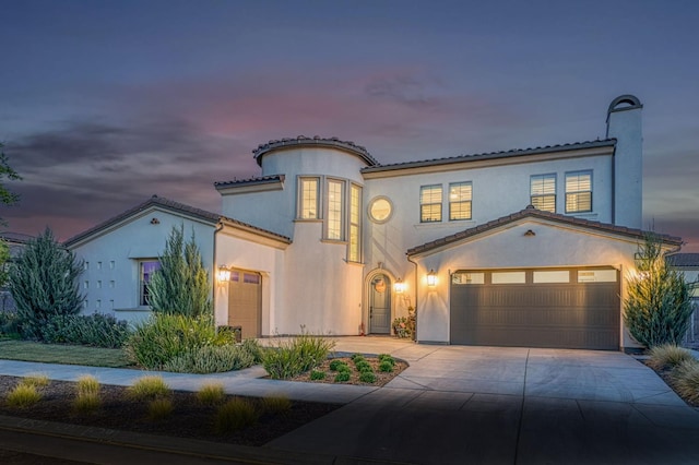 924 Orchard Hills Rd, Madera, CA 93636 - mediterranean / spanish-style home with concrete driveway, stucco siding, a tile roof, and an attached garage