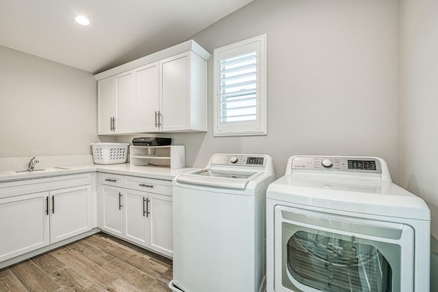 924 Orchard Hills Rd, Madera, CA 93636 - washroom featuring separate washer and dryer, cabinet space, and light wood-type flooring