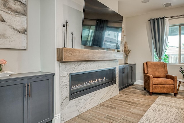 924 Orchard Hills Rd, Madera, CA 93636 - living room with light wood-style floors and a fireplace