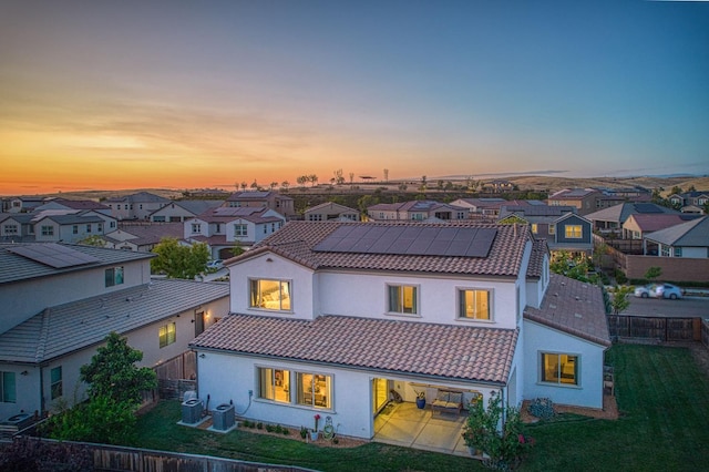 924 Orchard Hills Rd, Madera, CA 93636 - view of front of property with solar panels, a residential view, a fenced backyard, a patio, and a tile roof