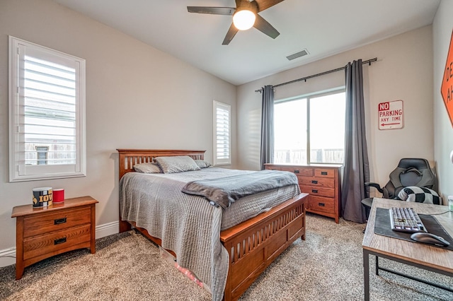 924 Orchard Hills Rd, Madera, CA 93636 - bedroom with light colored carpet, multiple windows, and a ceiling fan