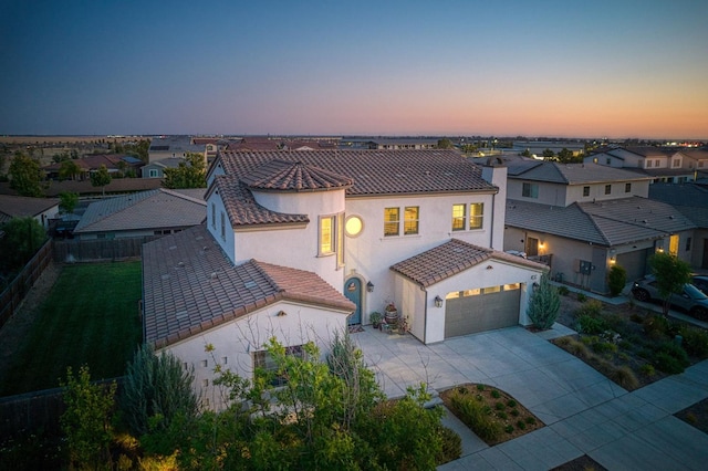 924 Orchard Hills Rd, Madera, CA 93636 - view of front of property with concrete driveway, stucco siding, a tile roof, an attached garage, and a residential view