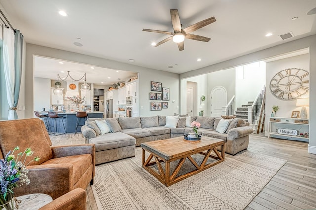 924 Orchard Hills Rd, Madera, CA 93636 - living room with a ceiling fan, stairway, light wood-style flooring, and recessed lighting