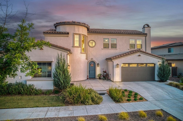 924 Orchard Hills Rd, Madera, CA 93636 - mediterranean / spanish home featuring concrete driveway, stucco siding, and a tile roof
