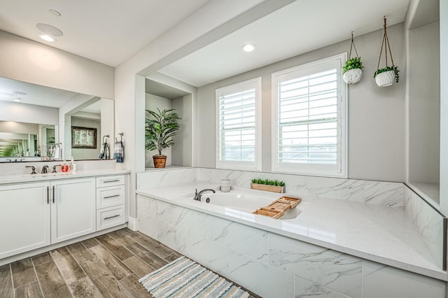 924 Orchard Hills Rd, Madera, CA 93636 - bathroom with vanity, a bath, recessed lighting, and wood finished floors