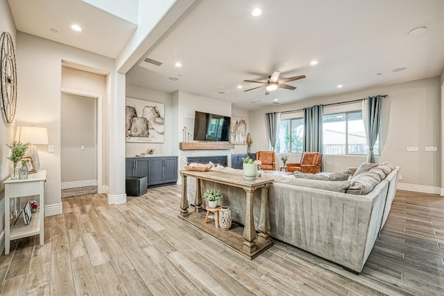 924 Orchard Hills Rd, Madera, CA 93636 - living room with light wood-type flooring, ceiling fan, recessed lighting, and a fireplace