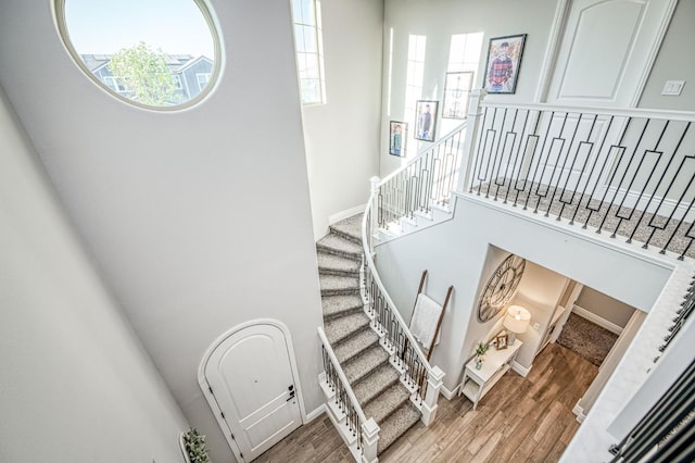 924 Orchard Hills Rd, Madera, CA 93636 - staircase featuring healthy amount of natural light, wood finished floors, and a towering ceiling