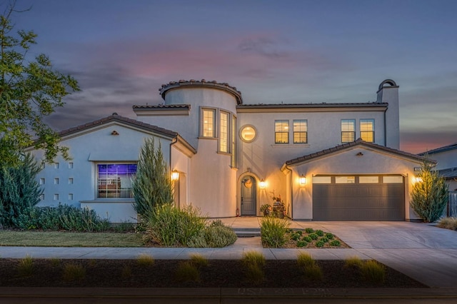 924 Orchard Hills Rd, Madera, CA 93636 - mediterranean / spanish-style house with driveway, stucco siding, a chimney, and a tiled roof