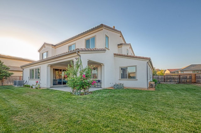 924 Orchard Hills Rd, Madera, CA 93636 - rear view of property featuring a patio area, a fenced backyard, stucco siding, and a tiled roof