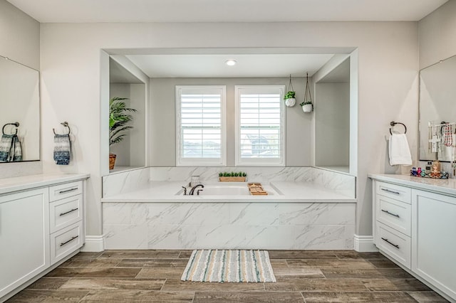 924 Orchard Hills Rd, Madera, CA 93636 - bathroom with vanity, a bath, and wood finished floors