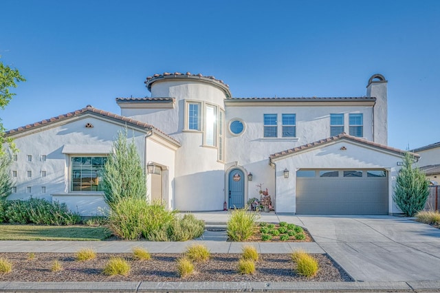 924 Orchard Hills Rd, Madera, CA 93636 - mediterranean / spanish house featuring stucco siding, concrete driveway, a chimney, a tiled roof, and a garage