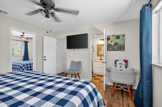 53401 Timberview Rd, North Fork, CA 93643 - bedroom with wood finished floors, ceiling fan, and ensuite bathroom