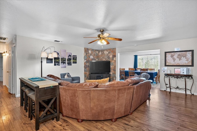 53401 Timberview Rd, North Fork, CA 93643 - living room with wood finished floors, a ceiling fan, and a textured ceiling