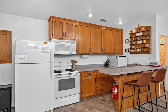 53401 Timberview Rd, North Fork, CA 93643 - kitchen featuring white appliances, open shelves, brown cabinetry, a kitchen bar, and a peninsula