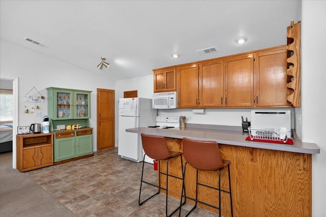 53401 Timberview Rd, North Fork, CA 93643 - kitchen featuring white appliances, a peninsula, a kitchen breakfast bar, open shelves, and brown cabinetry