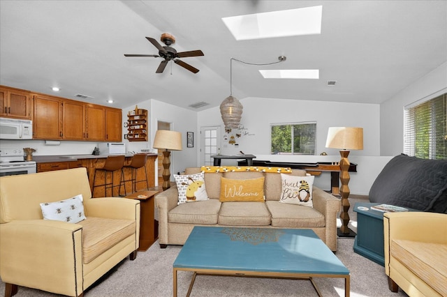 53401 Timberview Rd, North Fork, CA 93643 - living area featuring a skylight, light carpet, lofted ceiling, ceiling fan, and recessed lighting