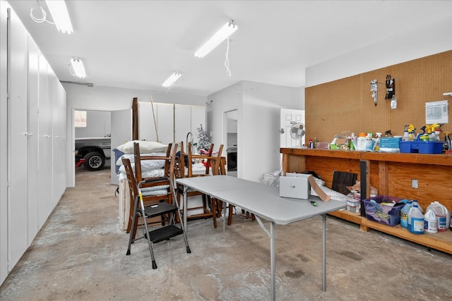 53401 Timberview Rd, North Fork, CA 93643 - home office featuring unfinished concrete floors and a workshop area