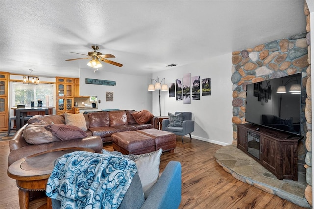 53401 Timberview Rd, North Fork, CA 93643 - living room with wood finished floors, a ceiling fan, and a textured ceiling