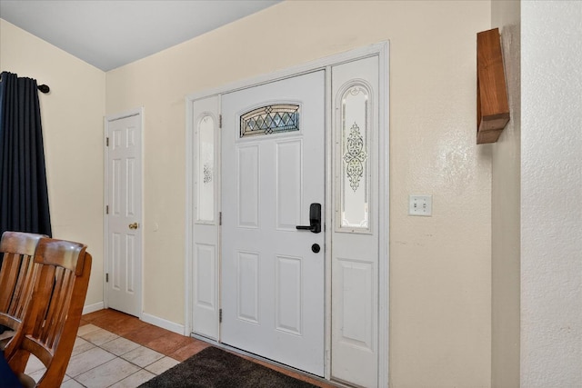 53401 Timberview Rd, North Fork, CA 93643 - entryway featuring light tile patterned flooring and baseboards