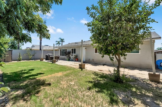 4679 E Pitt Ave, Fresno, CA 93725 - rear view of property with stucco siding and a patio