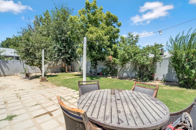 4679 E Pitt Ave, Fresno, CA 93725 - fenced backyard featuring outdoor dining space and a patio area
