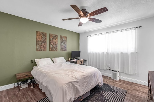 4679 E Pitt Ave, Fresno, CA 93725 - bedroom featuring wood finished floors and a ceiling fan