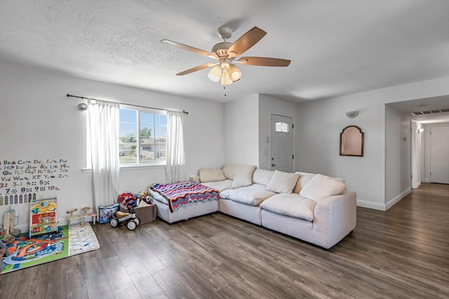 4679 E Pitt Ave, Fresno, CA 93725 - living area with wood finished floors and a ceiling fan