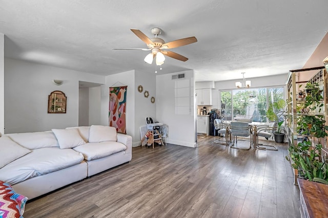 4679 E Pitt Ave, Fresno, CA 93725 - living area with ceiling fan, dark wood-style flooring, and a chandelier