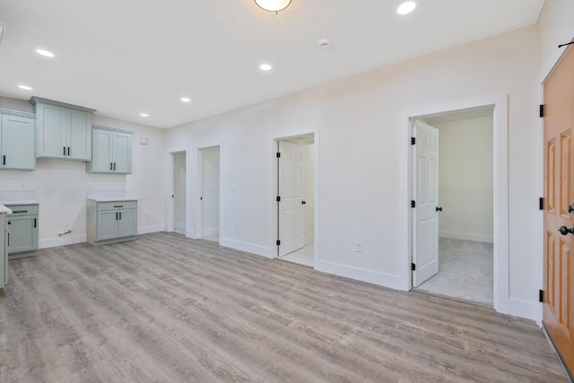 221 N Orchard St, Fresno, CA 93701 - unfurnished living room with light wood finished floors and recessed lighting