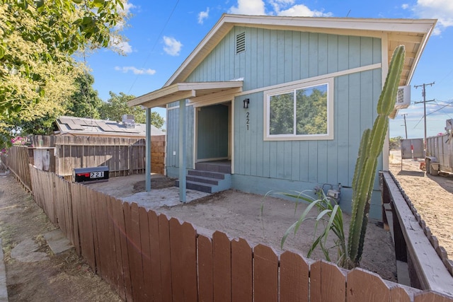 221 N Orchard St, Fresno, CA 93701 - view of front facade featuring a fenced backyard, entry steps, and a patio