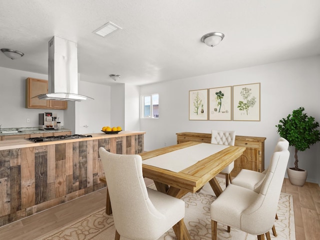2557 Jackson St, Selma, CA 93662 - dining area featuring light wood finished floors