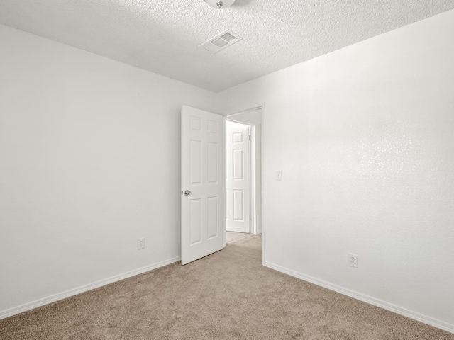 2557 Jackson St, Selma, CA 93662 - spare room with light carpet and a textured ceiling