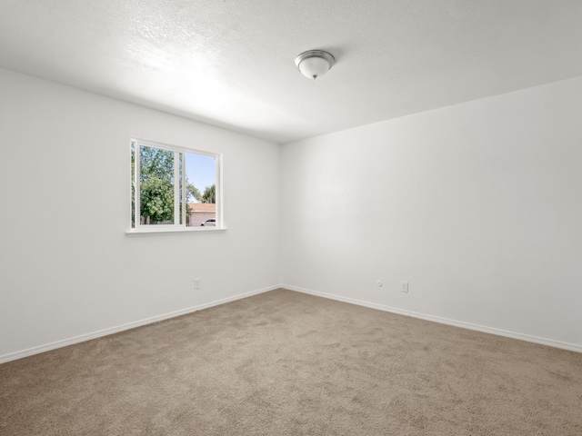 2557 Jackson St, Selma, CA 93662 - carpeted spare room featuring baseboards
