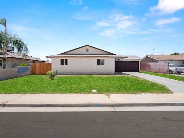 2557 Jackson St, Selma, CA 93662 - ranch-style house featuring a garage, stucco siding, and driveway