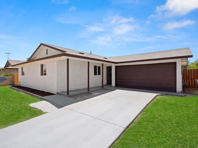 2557 Jackson St, Selma, CA 93662 - ranch-style house with driveway, an attached garage, and stucco siding
