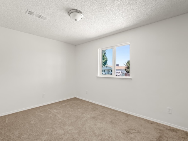 2557 Jackson St, Selma, CA 93662 - spare room featuring carpet flooring and a textured ceiling