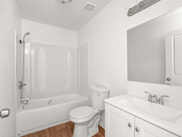 2557 Jackson St, Selma, CA 93662 - bathroom with wood finished floors, vanity, and bathing tub / shower combination