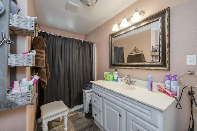 448 E Tuolumne St, Fresno, CA 93706 - bathroom featuring vanity, wood finished floors, and curtained shower